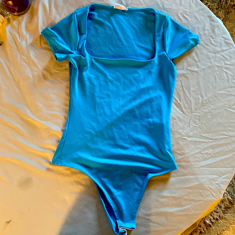 Live In The Moment - turquoise body suit.  Satin-like feel.